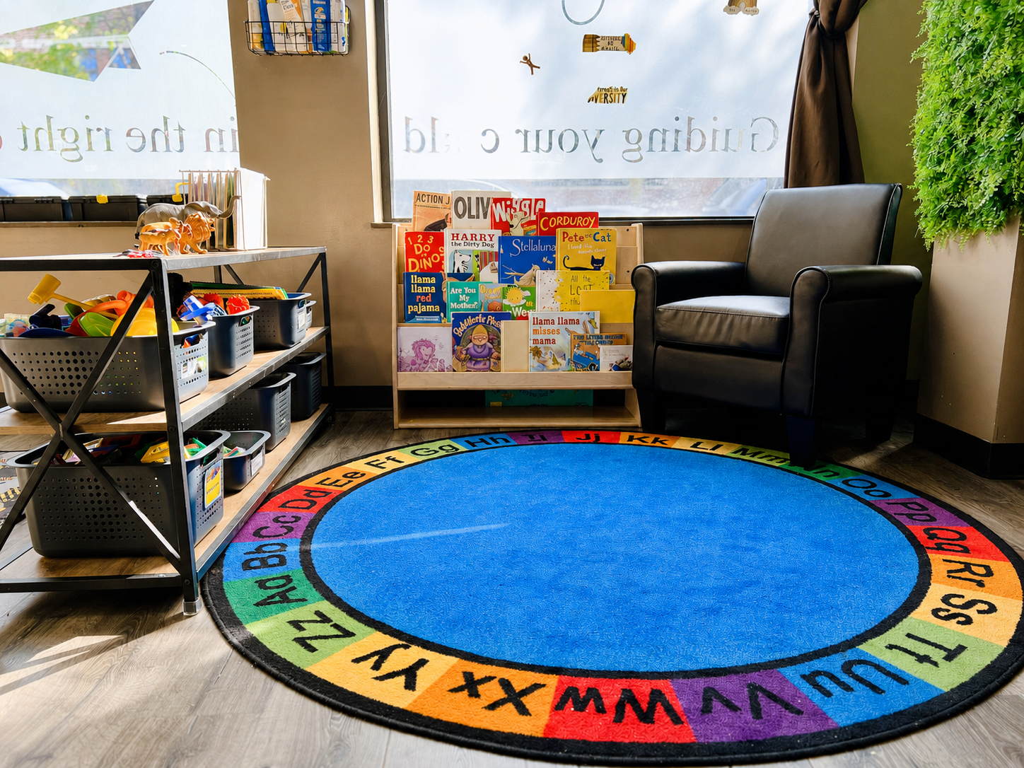 West Loop preschool classroom with books, learning materials, and an alphabet gathering rug.